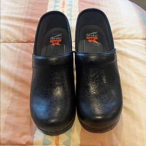 Dansko XP Black Embossed Clogs